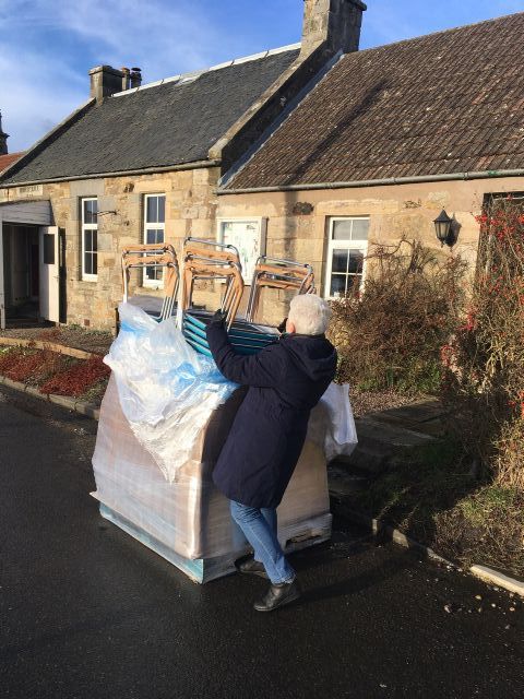 Chairs from new funding unloaded at speed by Evelyn & Mary between snow showers!